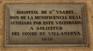 Placa sobre la fachada del Hospital Civil de Matanzas conmemorando su inauguración bajo la advocación de Santa Isabel.