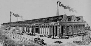 Grabado y vista exterior de la gran fábrica de camas y fundición de hierro y bronce de los señores Gaubeca y Ca. (S. en C.) establecida en Luyanó (Ca. 1915).
