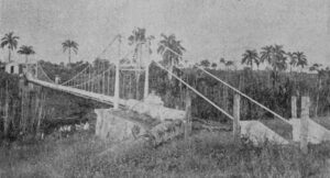 Acueducto de Matanzas. Puente colgante de acero sobre el río San Agustín para conducir la tubería principal a la ciudad (Ca. 1901).